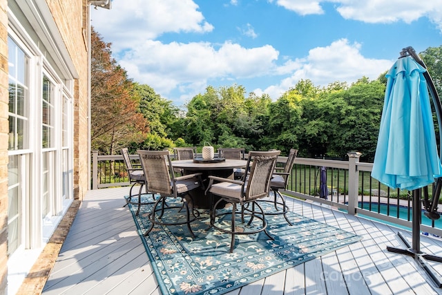 1115 Maremont Ct, Matthews, NC 28104 - deck featuring outdoor dining space and view of wooded area