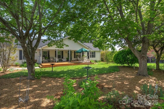54 Donna Ln, Alexander, NC 28701 - rear view of property featuring a lawn and a porch