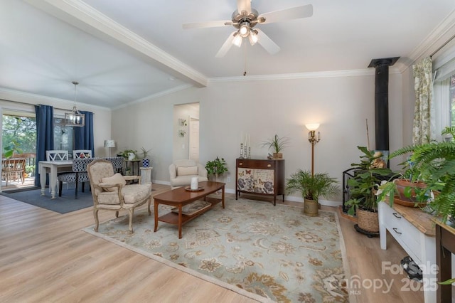 54 Donna Ln, Alexander, NC 28701 - living room featuring wood finished floors, ceiling fan, baseboards, ornamental molding, and lofted ceiling