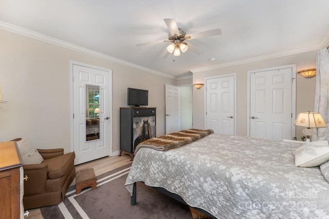 54 Donna Ln, Alexander, NC 28701 - bedroom with crown molding, a ceiling fan, and two closets