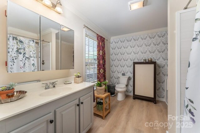 54 Donna Ln, Alexander, NC 28701 - bathroom featuring wallpapered walls, vanity, wood finished floors, toilet, and crown molding