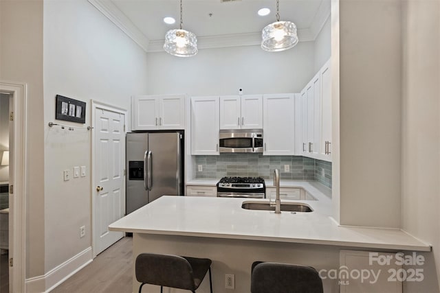 718 W Trade St Unit 105, Charlotte, NC 28202 - kitchen featuring appliances with stainless steel finishes, ornamental molding, decorative backsplash, white cabinetry, and a high ceiling