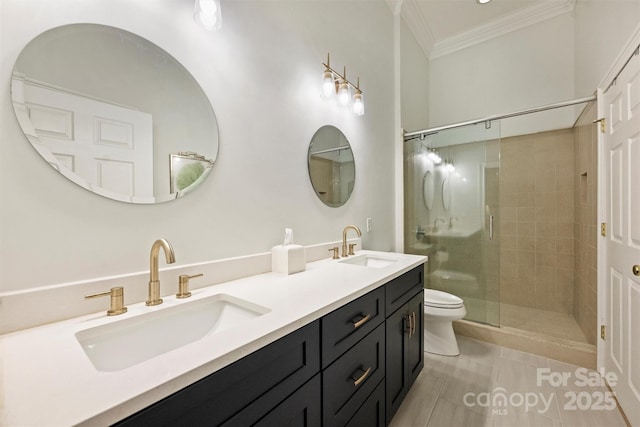 718 W Trade St Unit 105, Charlotte, NC 28202 - bathroom with crown molding, double vanity, a shower stall, and tile patterned floors