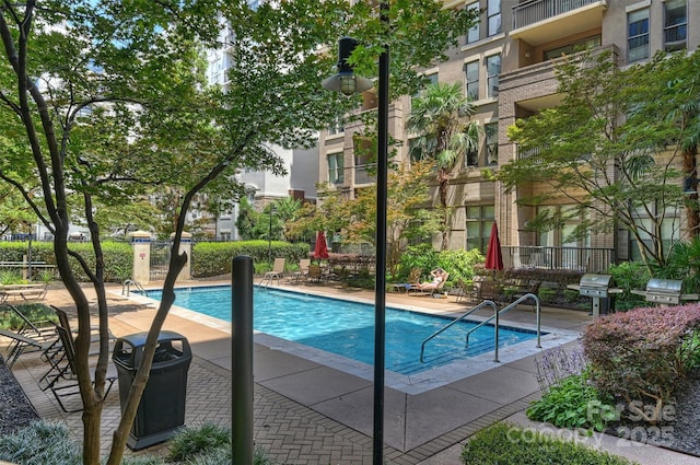 718 W Trade St Unit 105, Charlotte, NC 28202 - community pool featuring a patio and grilling area