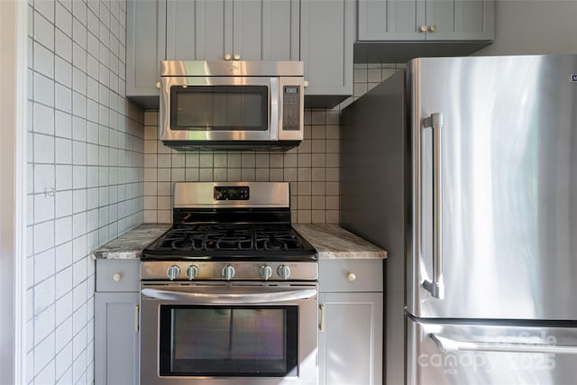 110 Annandale Ave, Asheville, NC 28801 - kitchen featuring stainless steel appliances, backsplash, and gray cabinets