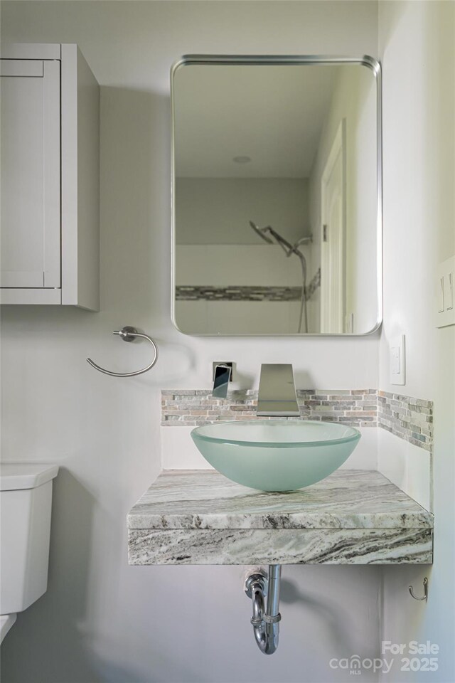 110 Annandale Ave, Asheville, NC 28801 - bathroom featuring decorative backsplash, toilet, and vanity