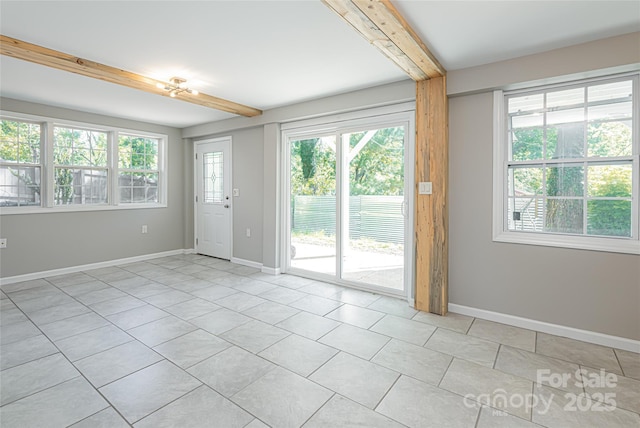 110 Annandale Ave, Asheville, NC 28801 - unfurnished room featuring beamed ceiling, light tile patterned floors, and baseboards