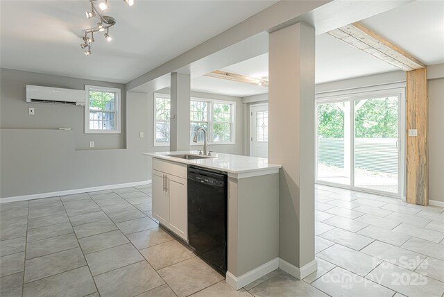 110 Annandale Ave, Asheville, NC 28801 - kitchen with dishwasher, a sink, a wall mounted AC, light countertops, and light tile patterned flooring