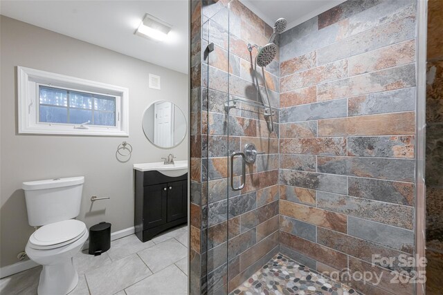 110 Annandale Ave, Asheville, NC 28801 - full bathroom with a tile shower, vanity, toilet, baseboards, and tile patterned floors