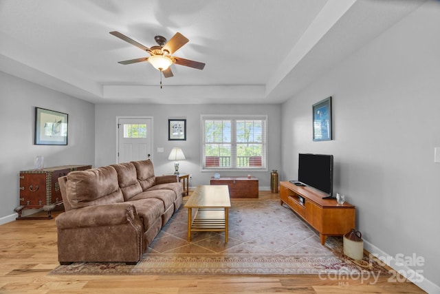 17 Laurel Rd, Arden, NC 28704 - living area with a raised ceiling, baseboards, a ceiling fan, and light wood finished floors