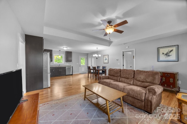 17 Laurel Rd, Arden, NC 28704 - living area featuring ceiling fan, a tray ceiling, a chandelier, and wood finished floors