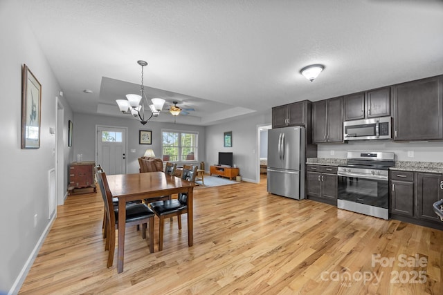 17 Laurel Rd, Arden, NC 28704 - dining space featuring light wood-style flooring, baseboards, and a chandelier