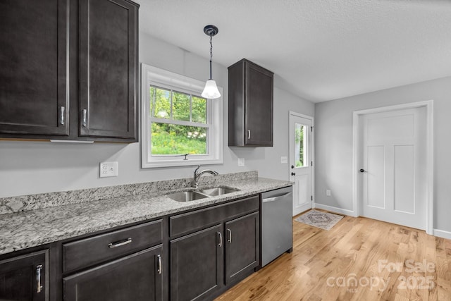 17 Laurel Rd, Arden, NC 28704 - kitchen with stainless steel dishwasher, a sink, healthy amount of natural light, and light wood-style flooring