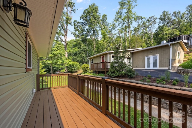 17 Laurel Rd, Arden, NC 28704 - wooden deck with french doors and view of wooded area