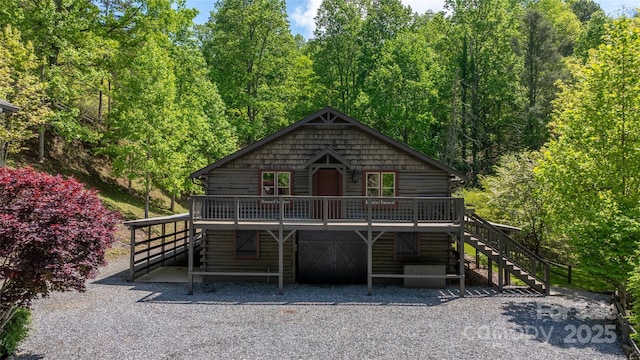 1283 Leafstone Cir, Sylva, NC 28779 - rustic home featuring stairway, log siding, a wooden deck, and a wooded view