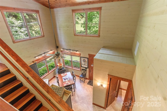 1283 Leafstone Cir, Sylva, NC 28779 - staircase featuring tile patterned floors, wooden walls, and vaulted ceiling
