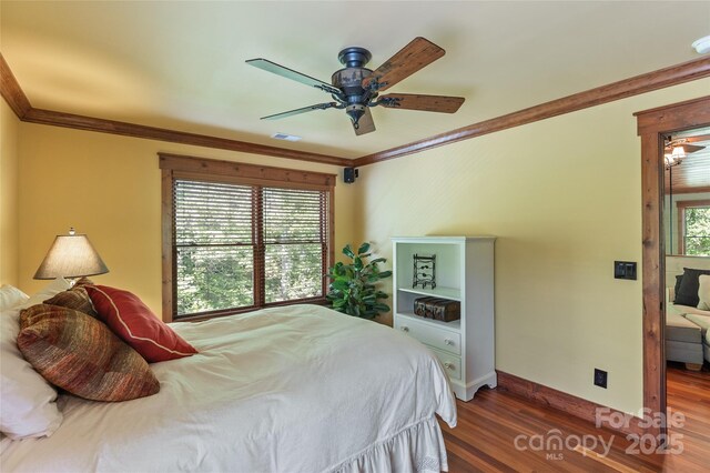1283 Leafstone Cir, Sylva, NC 28779 - bedroom featuring crown molding, wood finished floors, baseboards, and a ceiling fan