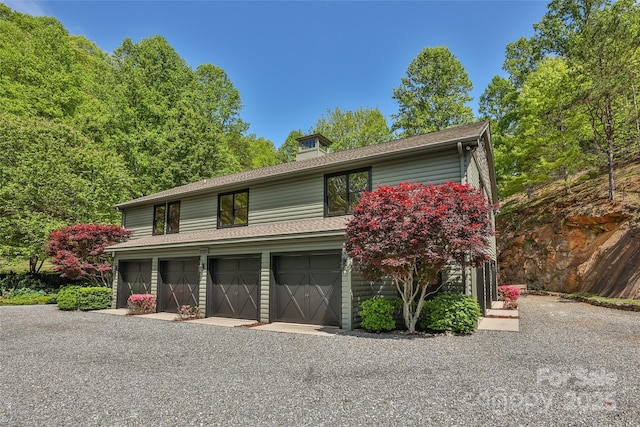 1283 Leafstone Cir, Sylva, NC 28779 - view of front of home featuring driveway, an attached garage, and a shingled roof