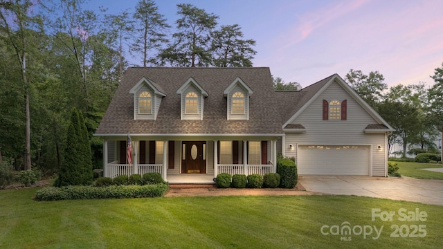 9372 Island Point Rd, Sherrills Ford, NC 28673 - new england style home with driveway, a porch, a front yard, a garage, and roof with shingles