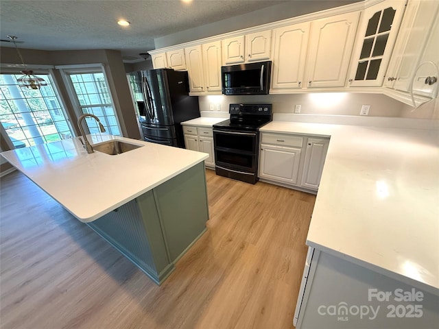 9372 Island Point Rd, Sherrills Ford, NC 28673 - kitchen featuring black appliances, light wood-style flooring, white cabinets, light countertops, and recessed lighting