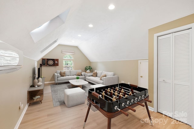 9372 Island Point Rd, Sherrills Ford, NC 28673 - playroom featuring wood finished floors, lofted ceiling, an AC wall unit, a skylight, and recessed lighting