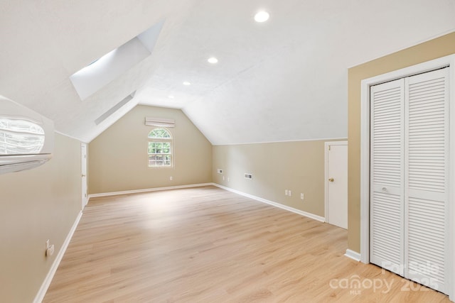 9372 Island Point Rd, Sherrills Ford, NC 28673 - bonus room featuring light wood-style floors, lofted ceiling, recessed lighting, a skylight, and a wall mounted AC