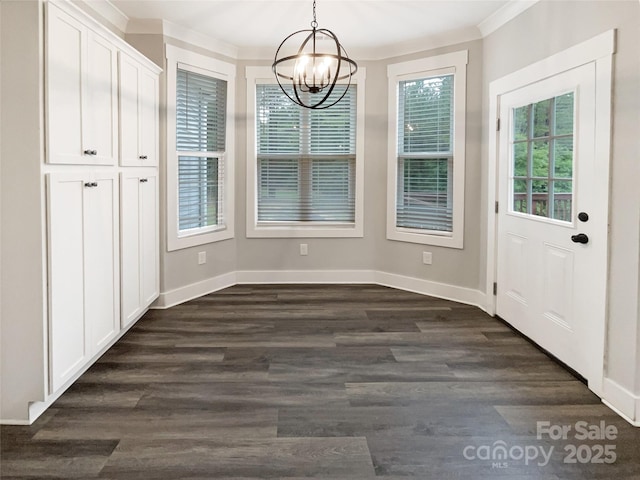 263 Lauren Pines Dr, York, SC 29745 - unfurnished dining area featuring a chandelier, ornamental molding, dark wood-type flooring, and baseboards