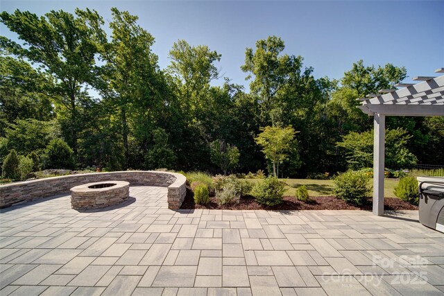 2035 Beacon Ave, Monroe, NC 28110 - view of patio / terrace with an outdoor fire pit and a pergola