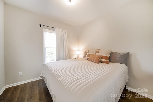 2035 Beacon Ave, Monroe, NC 28110 - bedroom featuring baseboards and wood finished floors