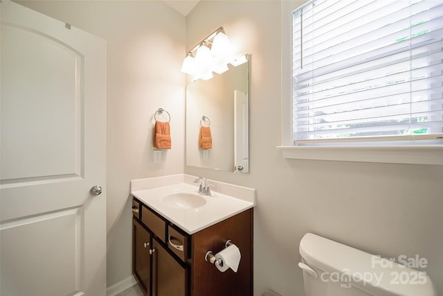 2035 Beacon Ave, Monroe, NC 28110 - half bathroom featuring vanity and toilet