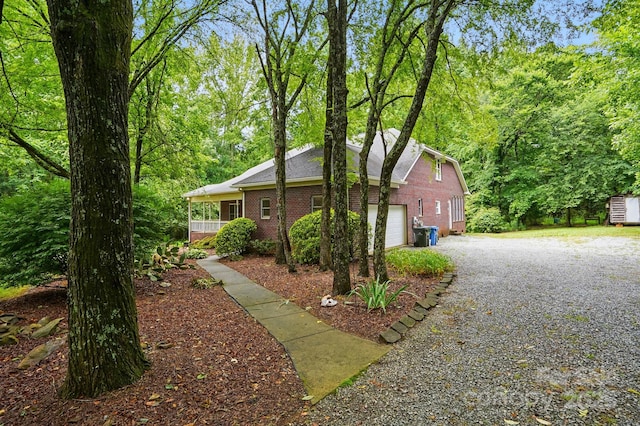 7725 Whitmire Ln, Mint Hill, NC 28227 - view of property exterior with brick siding, driveway, and a garage
