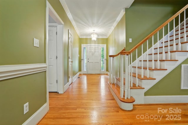 7725 Whitmire Ln, Mint Hill, NC 28227 - entrance foyer with stairs, wood finished floors, ornamental molding, and baseboards