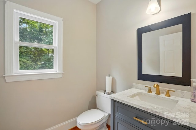 7725 Whitmire Ln, Mint Hill, NC 28227 - bathroom featuring vanity, toilet, and baseboards