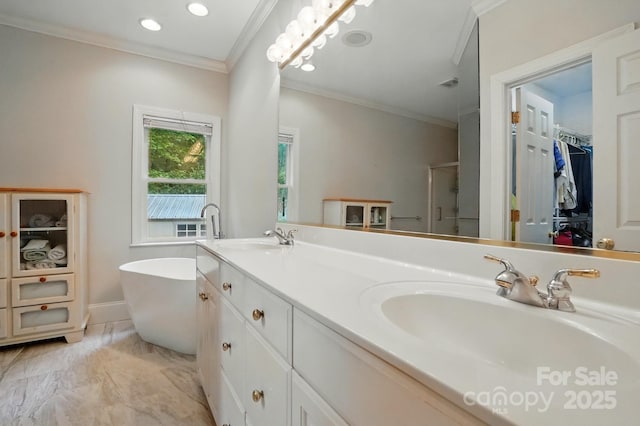 7725 Whitmire Ln, Mint Hill, NC 28227 - bathroom featuring crown molding, double vanity, a freestanding bath, a spacious closet, and a shower with shower door