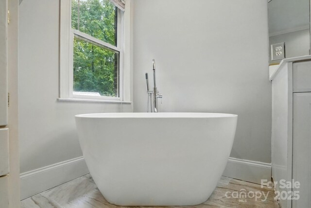 7725 Whitmire Ln, Mint Hill, NC 28227 - bathroom with baseboards and a freestanding bath