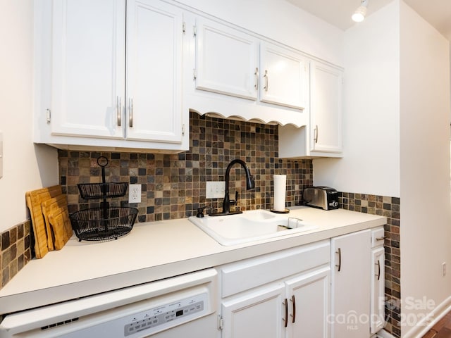 5809 Sharon Rd Unit G, Charlotte, NC 28210 - kitchen with a sink, dishwasher, white cabinetry, light countertops, and decorative backsplash