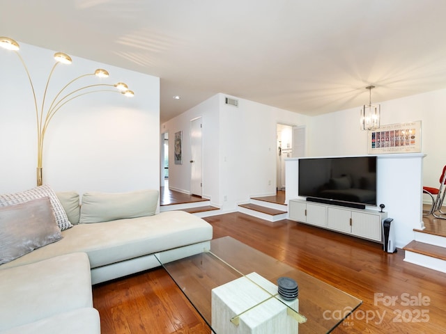 5809 Sharon Rd Unit G, Charlotte, NC 28210 - living area with a chandelier and wood finished floors