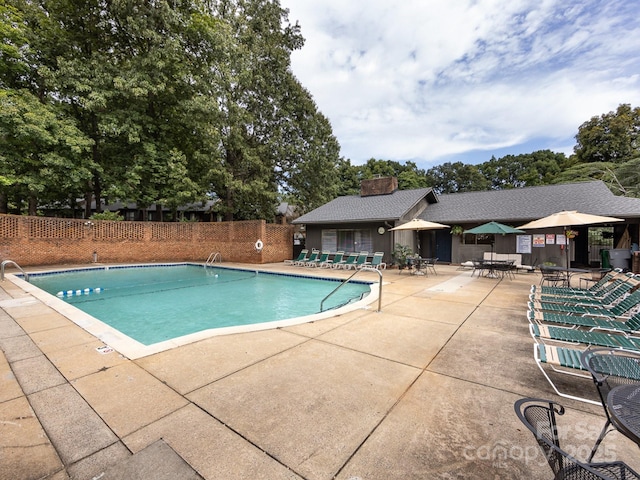 5809 Sharon Rd Unit G, Charlotte, NC 28210 - community pool with a patio area and view of wooded area