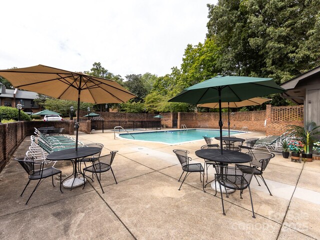 5809 Sharon Rd Unit G, Charlotte, NC 28210 - community pool featuring a patio area