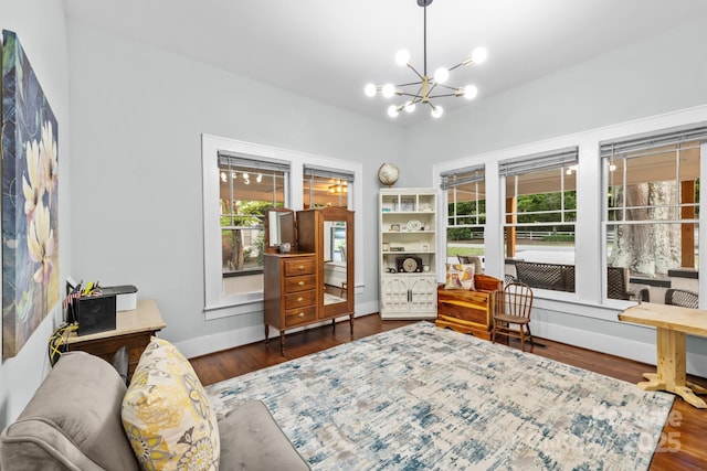 606 1st St W, Conover, NC 28613 - living area with plenty of natural light, a chandelier, wood finished floors, and baseboards