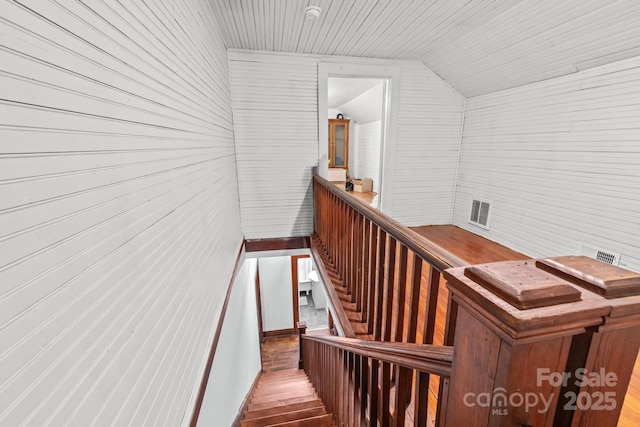 606 1st St W, Conover, NC 28613 - stairs featuring vaulted ceiling, wood finished floors, wooden walls, and wood ceiling