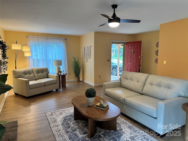 1228 Hidden Creek Cir, Hickory, NC 28602 - living room featuring a ceiling fan, wood finished floors, and baseboards
