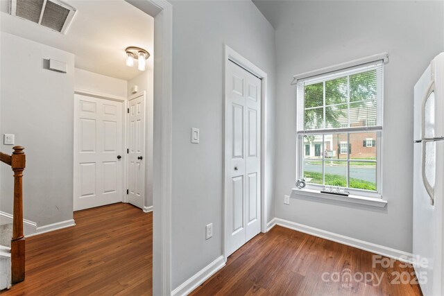 945 Heritage Pkwy, Fort Mill, SC 29715 - foyer with dark wood finished floors, healthy amount of natural light, and baseboards