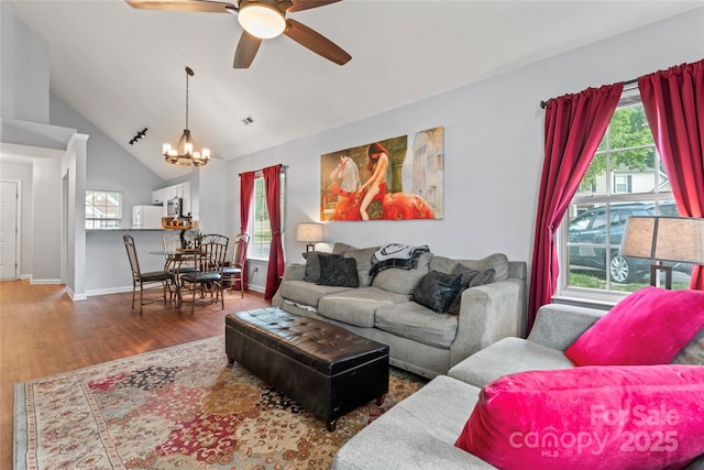 945 Heritage Pkwy, Fort Mill, SC 29715 - living room featuring a chandelier, wood finished floors, a ceiling fan, vaulted ceiling, and baseboards