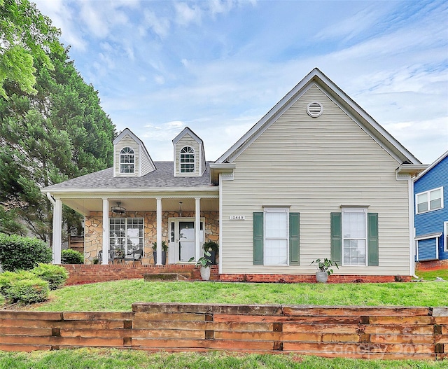 10449 Quiet Bay Ct, Charlotte, NC 28278 - view of front of home featuring a front yard, stone siding, and covered porch