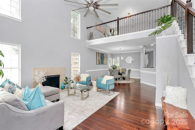 10449 Quiet Bay Ct, Charlotte, NC 28278 - living room featuring a high ceiling, healthy amount of natural light, wood finished floors, and a ceiling fan