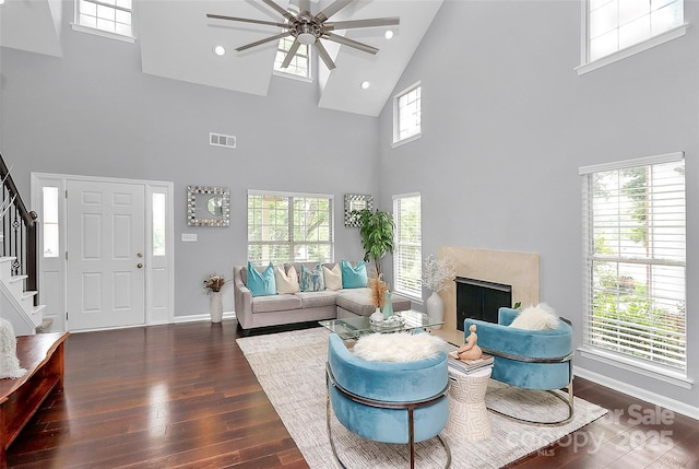 10449 Quiet Bay Ct, Charlotte, NC 28278 - living area featuring high vaulted ceiling, stairway, a ceiling fan, dark wood-style floors, and a fireplace