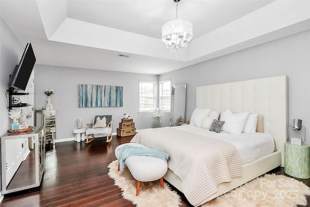 10449 Quiet Bay Ct, Charlotte, NC 28278 - bedroom with a chandelier, wood finished floors, baseboards, and a tray ceiling