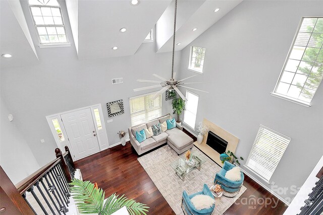 10449 Quiet Bay Ct, Charlotte, NC 28278 - living room featuring a high ceiling, wood finished floors, recessed lighting, plenty of natural light, and ceiling fan