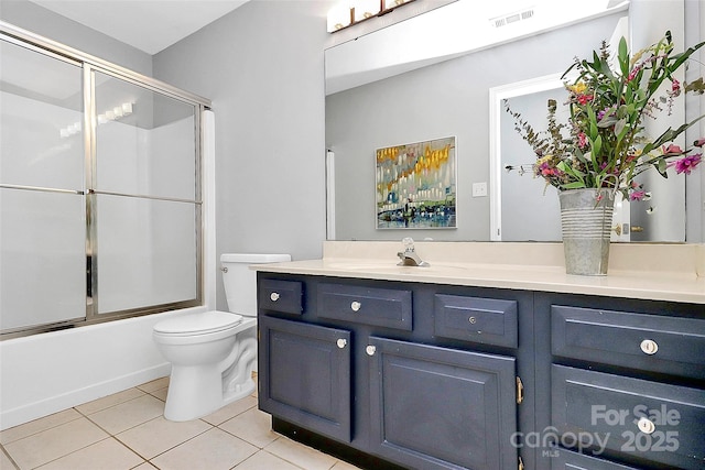 10449 Quiet Bay Ct, Charlotte, NC 28278 - bathroom with vanity, tile patterned floors, toilet, and enclosed tub / shower combo